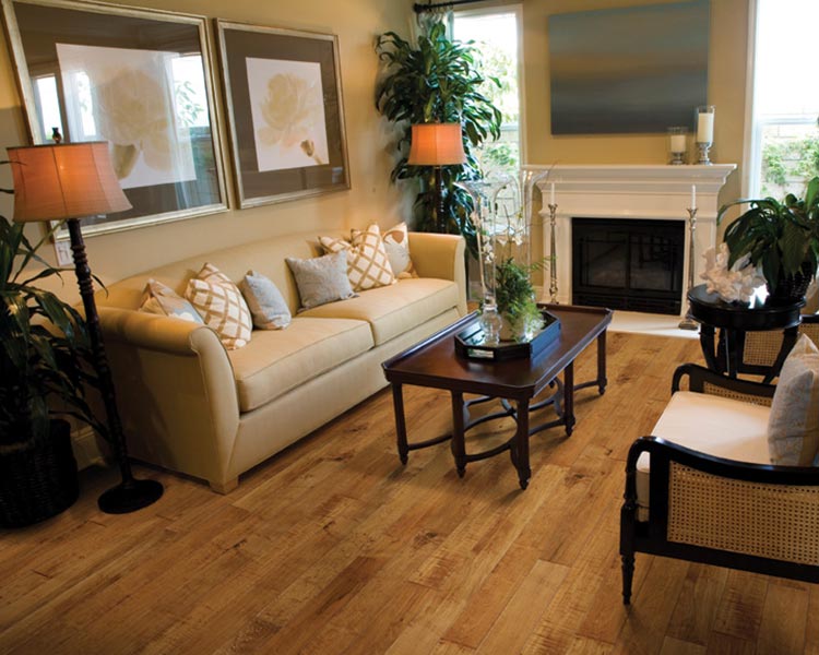 Maple Syrup Heirloom Hardwood Flooring Maple Syrup Heirloom Hardwood Flooring in a living room by Hallmark Floors