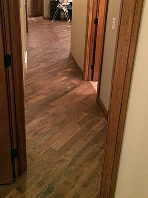 Organic Masala solid hardwood flooring installed a hallway.