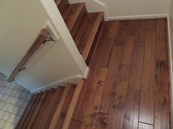 Abbot Flooring installed Heirloom Buckskin engineered hardwood flooring on a staircase for a homeowner.