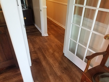 Hallmark Floors Courtier Waterproof Flooring color is Monarch Hickory home install completed by Hartwell Flooring Center