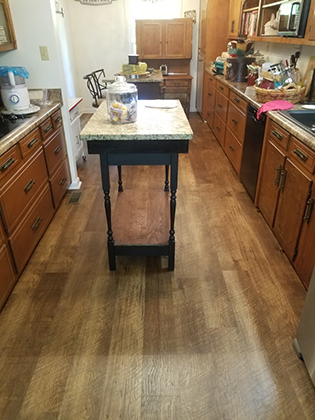 Hallmark Floors Courtier Waterproof Flooring color is Monarch Hickory installation completed by Hartwell Flooring Center