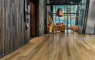 Sandal Oak hardwood flooring installed in a beautiful hotel lobby. Hallmark Commercial flooring.