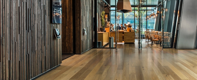 Sandal Oak hardwood flooring installed in a beautiful hotel lobby. Hallmark Commercial flooring.