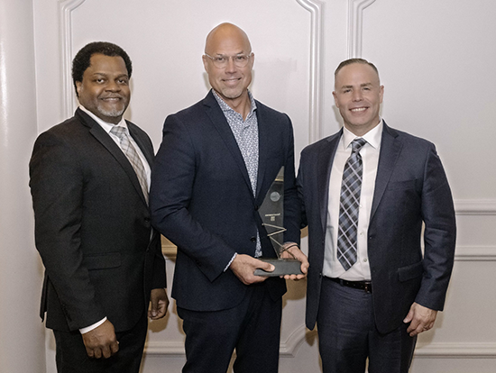 Mark Casper receives the Award of Excellence award from FCN